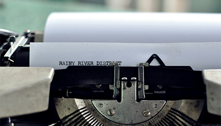 typewriter zoomed in with Rainy river district typed out
